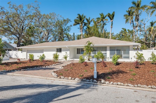 ranch-style house featuring a garage