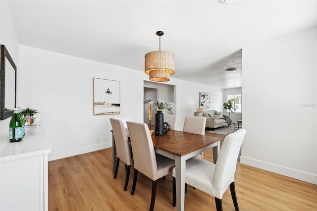 dining area featuring light wood-type flooring