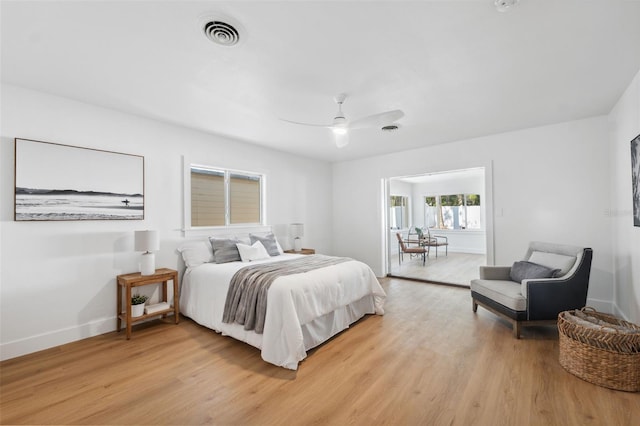 bedroom featuring ceiling fan and light wood-type flooring