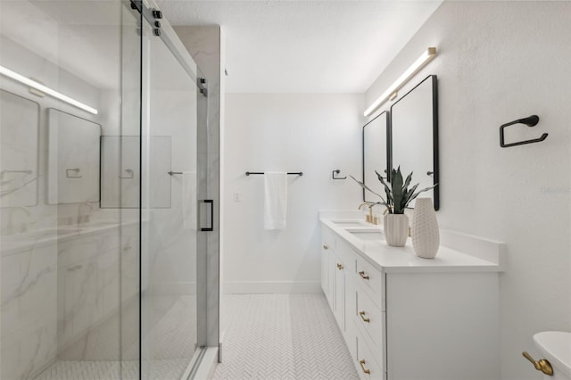 bathroom featuring vanity, toilet, tile patterned flooring, and a shower with door