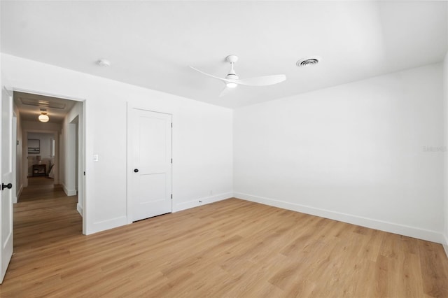 unfurnished bedroom with ceiling fan, a closet, and light wood-type flooring