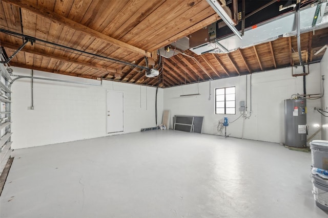 garage with a garage door opener and water heater