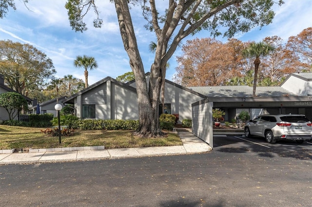 ranch-style house with a carport