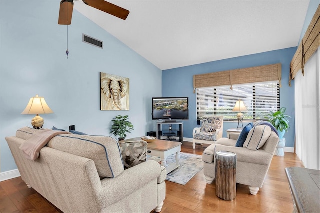 living room featuring wood-type flooring, high vaulted ceiling, and ceiling fan