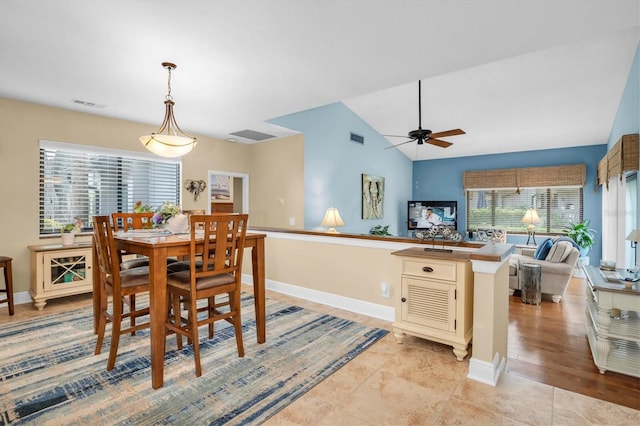 dining space featuring lofted ceiling and ceiling fan