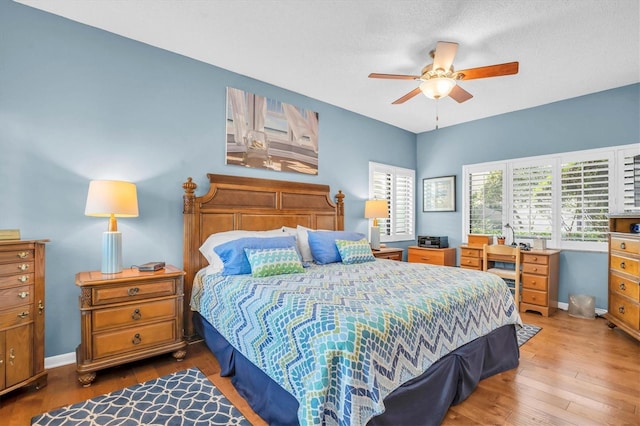 bedroom featuring wood-type flooring and ceiling fan