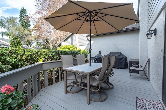 wooden deck featuring grilling area