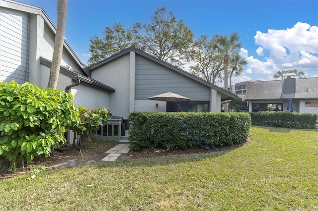 view of home's exterior featuring a yard