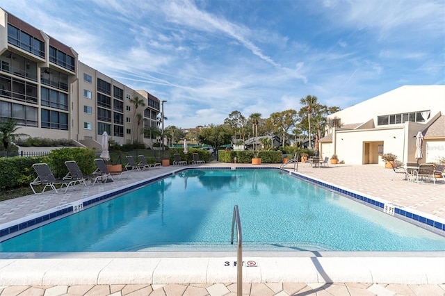 view of pool featuring a patio