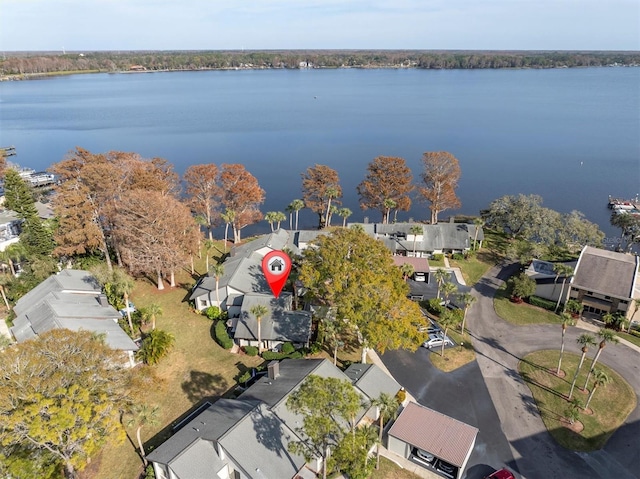 birds eye view of property with a water view