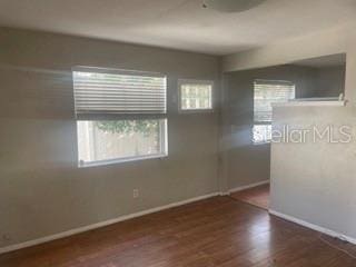 empty room featuring dark wood-type flooring