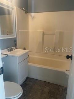 full bathroom featuring vanity, shower / washtub combination, and toilet