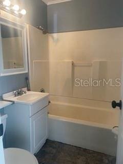 full bathroom with shower / bathtub combination, vanity, and toilet