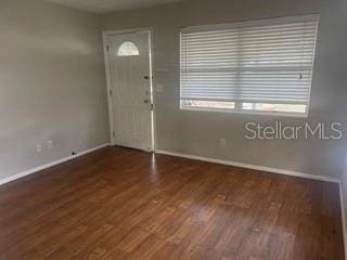 foyer entrance with dark hardwood / wood-style floors