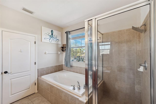 bathroom with a garden tub, a shower stall, visible vents, and tile patterned floors