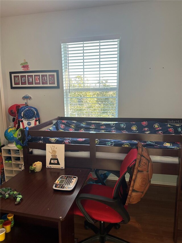 bedroom featuring wood finished floors