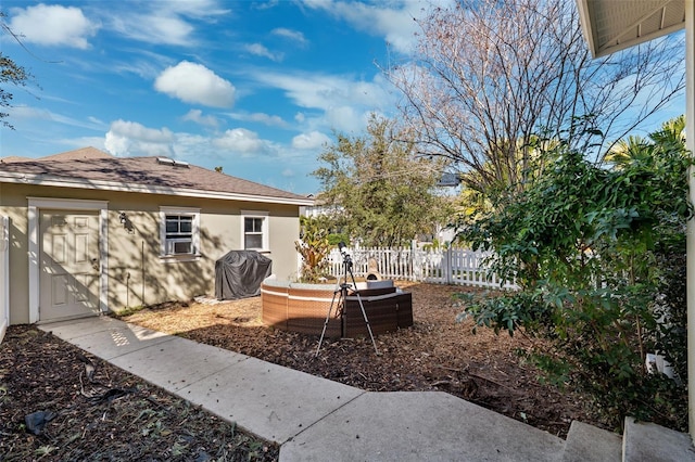 view of yard with fence and an outdoor living space