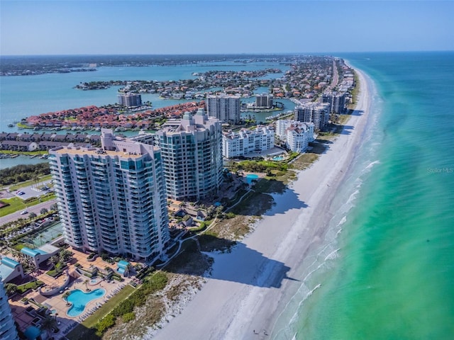 bird's eye view featuring a view of the beach and a water view