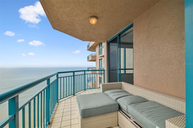 balcony featuring a water view