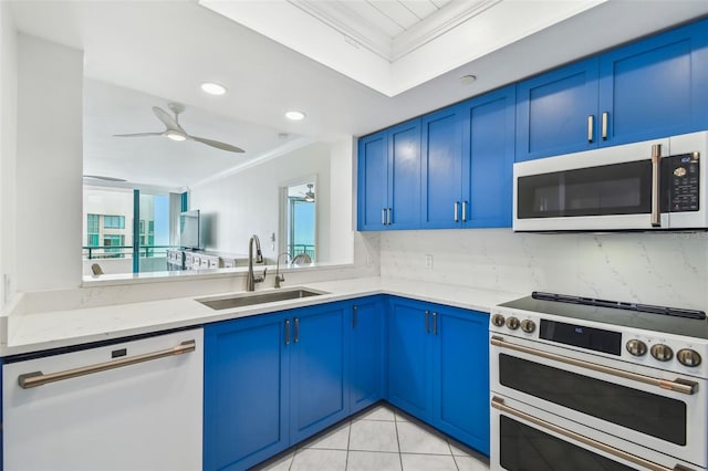 kitchen with blue cabinetry, sink, ornamental molding, white appliances, and decorative backsplash