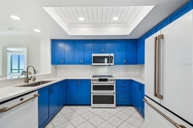 kitchen featuring crown molding, white appliances, a raised ceiling, and sink