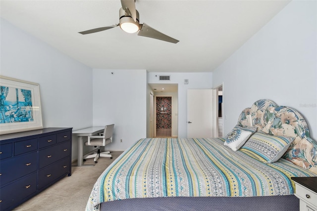 bedroom featuring ceiling fan and light carpet