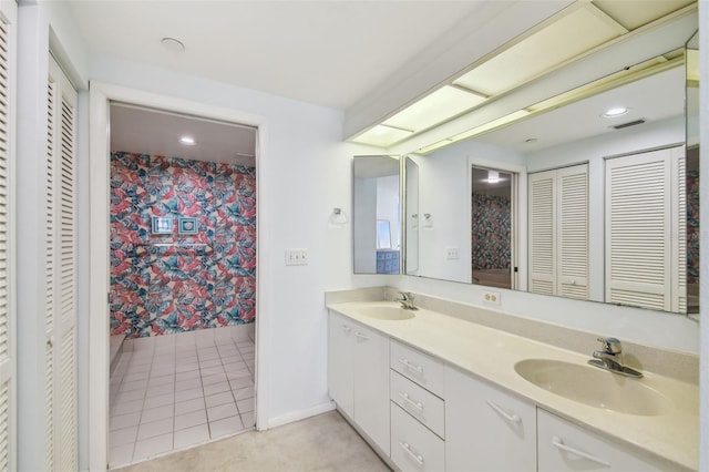 bathroom with vanity and tile patterned flooring