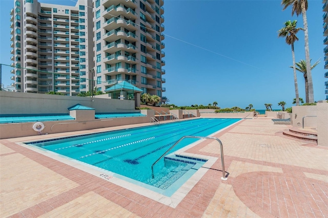 view of swimming pool featuring a patio area