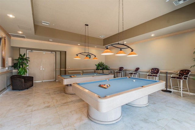 rec room with crown molding, a tray ceiling, and billiards