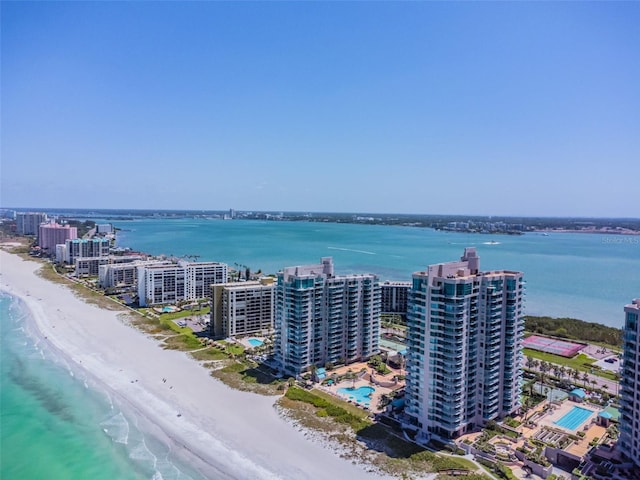 bird's eye view with a water view and a view of the beach