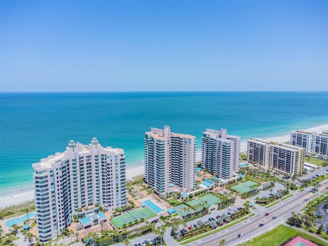 bird's eye view with a water view and a view of the beach