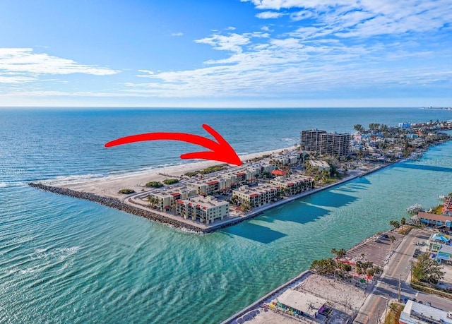 bird's eye view featuring a water view and a view of the beach