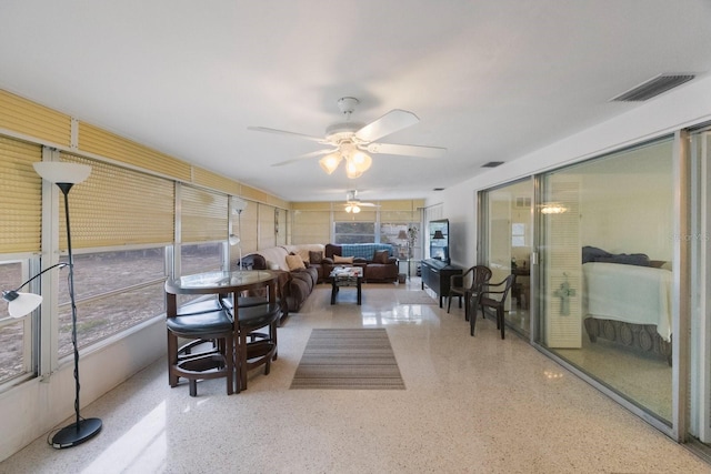 sunroom with ceiling fan