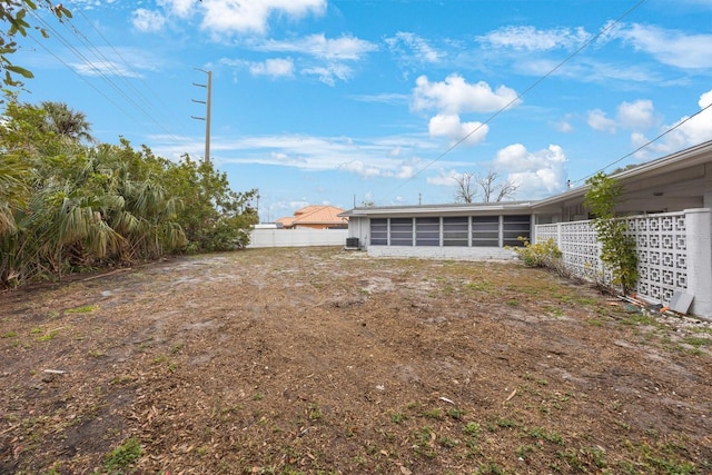 view of yard with a sunroom