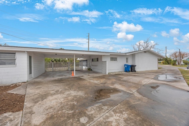 view of side of home with a carport