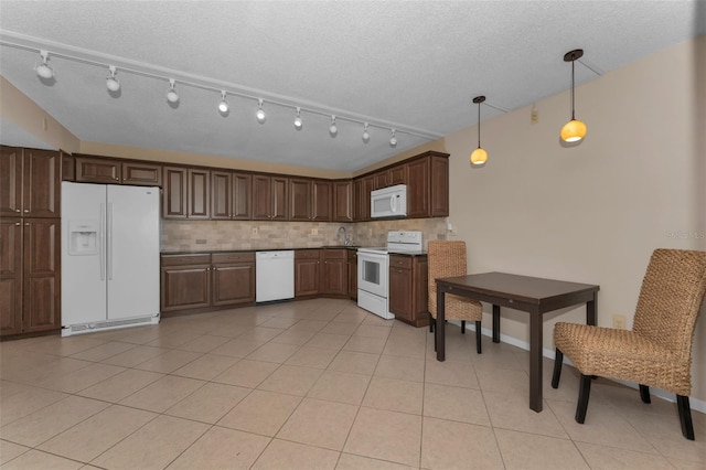 kitchen featuring pendant lighting, white appliances, a textured ceiling, light tile patterned flooring, and decorative backsplash