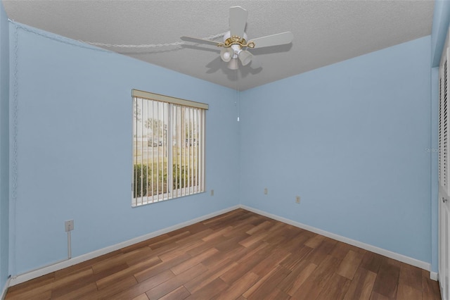 empty room with hardwood / wood-style flooring, a textured ceiling, and ceiling fan