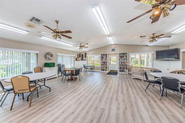 interior space featuring vaulted ceiling and light wood-type flooring