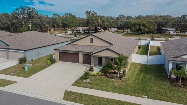 view of front facade featuring a garage and a front yard