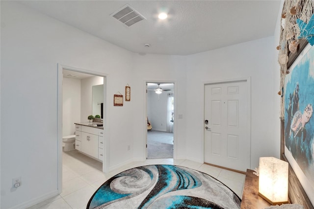 entrance foyer featuring light tile patterned floors