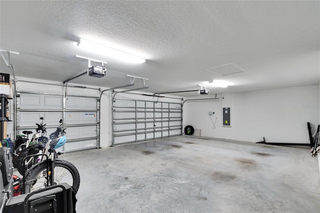 garage featuring a garage door opener and electric panel