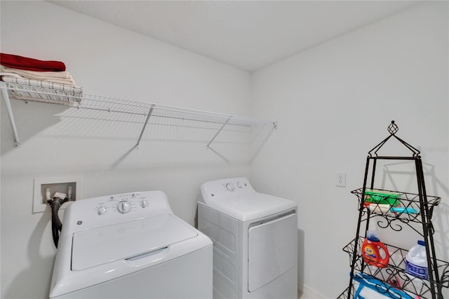 laundry area featuring washing machine and clothes dryer