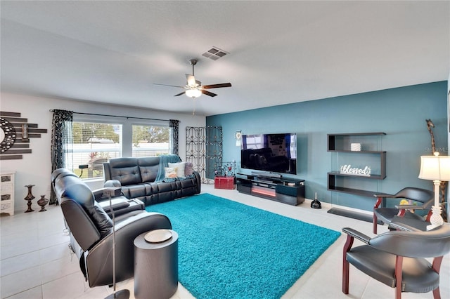 tiled living room featuring ceiling fan