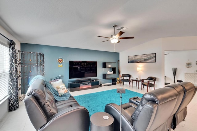 living room featuring lofted ceiling and ceiling fan