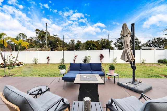 view of patio / terrace with an outdoor living space with a fire pit