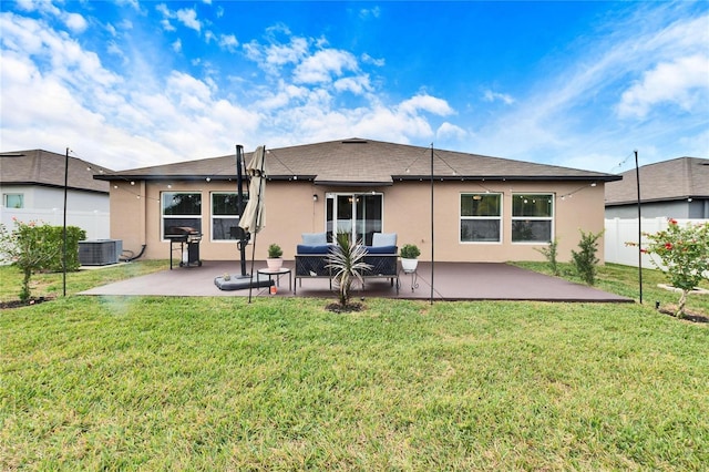 back of house with an outdoor hangout area, a yard, cooling unit, and a patio area