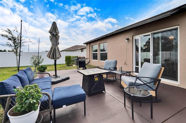 view of patio / terrace featuring an outdoor living space with a fire pit and grilling area