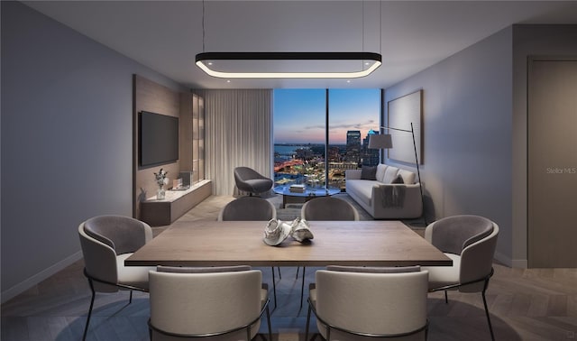 dining room with expansive windows and parquet flooring