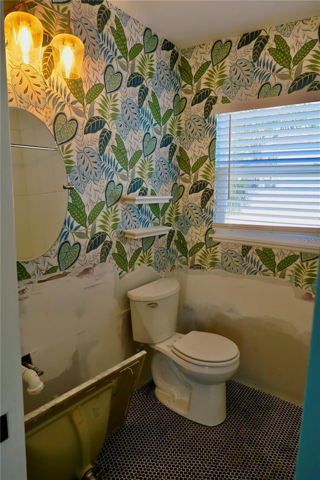 bathroom featuring tile patterned floors and toilet