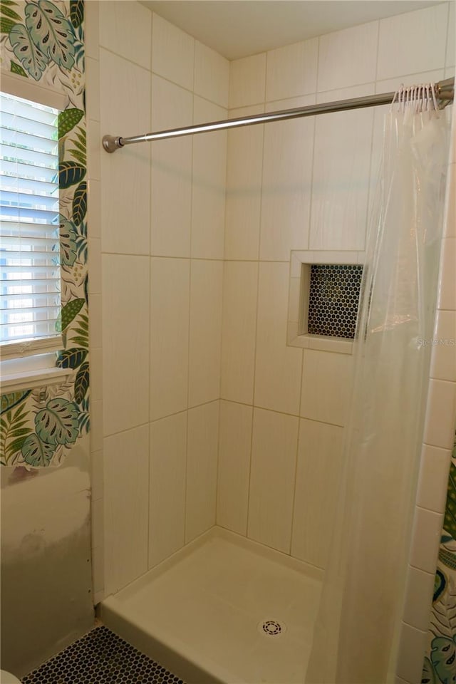 bathroom featuring a shower with curtain